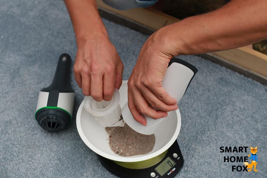 Dirt is weighed after vacuuming